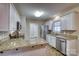 Well-appointed kitchen with granite countertops, stainless steel appliances, and bright white cabinets at 924 41St Avenue Ne Dr, Hickory, NC 28601