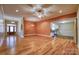 Open-concept living room featuring hardwood floors, ample lighting, and seamless flow to kitchen at 924 41St Avenue Ne Dr, Hickory, NC 28601