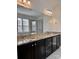 A bathroom showcasing double sinks with granite counters and a tiled glass shower at 1019 Dunhill Ln, Waxhaw, NC 28173