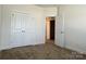 A spacious bedroom with a closet and an open doorway for easy access at 1019 Dunhill Ln, Waxhaw, NC 28173