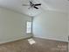 A well-lit bedroom featuring high ceilings and a window with natural light at 1019 Dunhill Ln, Waxhaw, NC 28173