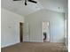 A comfortable bedroom with neutral walls leading into the bathroom and closet at 1019 Dunhill Ln, Waxhaw, NC 28173