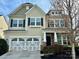 Charming two-story home with a two-car garage and well-maintained landscaping at 1019 Dunhill Ln, Waxhaw, NC 28173