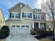 Charming two-story home with a two-car garage and well-maintained landscaping at 1019 Dunhill Ln, Waxhaw, NC 28173