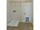 Functional laundry room with tile floor, utility sink, and washer/dryer hookups at 1019 Dunhill Ln, Waxhaw, NC 28173