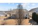 Cozy home featuring a covered patio, neutral siding, and a well-maintained lawn at 113 Artisan Ct, Mooresville, NC 28117