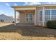 Inviting back porch with neutral siding and views of the neighborhood at 113 Artisan Ct, Mooresville, NC 28117