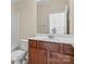 Bathroom features a wood vanity, white countertop, mirror, and toilet at 113 Artisan Ct, Mooresville, NC 28117
