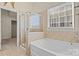 Bathroom featuring a glass enclosed shower and a separate soaking tub at 113 Artisan Ct, Mooresville, NC 28117