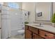 Bathroom featuring a shower-tub, vanity with wood cabinets and neutral countertops at 113 Artisan Ct, Mooresville, NC 28117