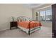 Bedroom with bay window, neutral carpet, and a black metal bed frame at 113 Artisan Ct, Mooresville, NC 28117