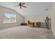 Bonus room featuring carpet flooring, natural lighting, and a decorative suit of armor at 113 Artisan Ct, Mooresville, NC 28117