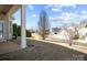 Side yard view of a home with a covered patio and manicured lawn area at 113 Artisan Ct, Mooresville, NC 28117