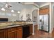 Open kitchen featuring stainless steel appliances, granite countertops, tile backsplash and island seating at 113 Artisan Ct, Mooresville, NC 28117