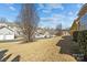 Neighborhood street showing homes with manicured lawns at 113 Artisan Ct, Mooresville, NC 28117