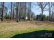 Expansive backyard with mature trees, perfect for outdoor activities and privacy at 118 Sunset Dr, Chester, SC 29706