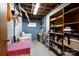 An unfinished basement area with exposed ceiling, laundry area, and storage shelves, providing ample utility space at 118 Sunset Dr, Chester, SC 29706