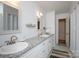Bright bathroom features double sinks with granite countertops, white cabinetry, and tile flooring at 118 Sunset Dr, Chester, SC 29706