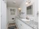 Bright bathroom features double sinks with granite countertops, white cabinetry, and tile flooring at 118 Sunset Dr, Chester, SC 29706