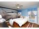 This blue bedroom features a ceiling fan and a large mural of a space shuttle on one wall at 118 Sunset Dr, Chester, SC 29706