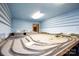 Bright bonus room featuring a built in model railroad area, custom backdrop, blue walls and trim at 118 Sunset Dr, Chester, SC 29706