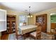 Inviting dining room with wooden furniture, floral seat cushions, and natural light from a window at 118 Sunset Dr, Chester, SC 29706