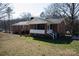 Charming brick home featuring a screened porch and well-maintained front yard at 118 Sunset Dr, Chester, SC 29706