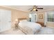 Bedroom featuring a ceiling fan, carpeted floor, and a bed at 11924 Parks Farm Ln, Charlotte, NC 28277
