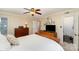 Bedroom showcases neutral paint, a ceiling fan, and a doorway to the Primary bath at 11924 Parks Farm Ln, Charlotte, NC 28277