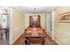 Classic dining room with beautiful hardwood floors, traditional furnishings, and ample natural light at 11924 Parks Farm Ln, Charlotte, NC 28277