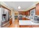 Modern kitchen with stainless steel appliances, quartz countertops, and ample cabinet space for the home chef at 11924 Parks Farm Ln, Charlotte, NC 28277