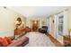 Spacious living room with hardwood floors, neutral walls, and an open view to the dining area at 11924 Parks Farm Ln, Charlotte, NC 28277