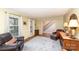 Cozy living room with hardwood floors, large windows, and comfortable leather seating at 11924 Parks Farm Ln, Charlotte, NC 28277