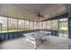 Spacious sunroom with a ping pong table and views of the backyard at 11924 Parks Farm Ln, Charlotte, NC 28277
