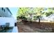 Home's backyard with patio, table, and view of fence and mature trees at 1210 Croft Dr # 96, Fort Mill, SC 29708