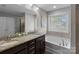 The primary bathroom features dual sinks, granite countertops, a soaking tub, and a separate shower at 1210 Croft Dr # 96, Fort Mill, SC 29708