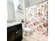 Charming bathroom with stylish floral shower curtain, granite vanity, and a fluffy pink rug at 1210 Croft Dr # 96, Fort Mill, SC 29708