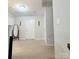 Well-lit bonus room with neutral carpet, closet, and door to another area of the house at 1210 Croft Dr # 96, Fort Mill, SC 29708