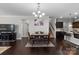 Inviting dining area featuring hardwood floors, chandelier, and ample space for entertaining at 1210 Croft Dr # 96, Fort Mill, SC 29708