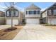 Charming townhome featuring a two-car garage, stone accents, and neutral-colored siding at 1210 Croft Dr # 96, Fort Mill, SC 29708