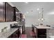 Modern kitchen with granite countertops, stainless steel appliances, and dark wood cabinets at 1210 Croft Dr # 96, Fort Mill, SC 29708