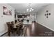 Open-concept living room featuring a dining area and a modern kitchen with sleek countertops at 1210 Croft Dr # 96, Fort Mill, SC 29708