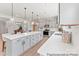 Spacious open-concept kitchen featuring a large island, modern appliances, and stylish pendant lighting at 122 Tillery Ln # 759P, Mount Gilead, NC 27306