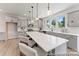 Bright kitchen showcasing white countertops, stainless steel appliances, and a central island with pendant lights at 122 Tillery Ln # 759P, Mount Gilead, NC 27306