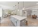 Open-concept kitchen seamlessly flowing into a dining and living area, perfect for entertaining at 122 Tillery Ln # 759P, Mount Gilead, NC 27306