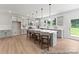 Well-lit kitchen featuring an island with seating, stainless steel appliances, and lots of natural light at 122 Tillery Ln # 759P, Mount Gilead, NC 27306