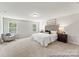 Bright main bedroom features neutral carpet, fresh paint, and a large windows with natural light at 122 Tillery Ln # 759P, Mount Gilead, NC 27306
