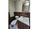 Cozy bathroom featuring a vanity with storage, toilet, and coordinating accessories at 1222 Sparrow Springs Rd, Kings Mountain, NC 28086