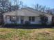 Classic single story home featuring a covered front porch and traditional siding, set against a backdrop of mature trees at 1222 Sparrow Springs Rd, Kings Mountain, NC 28086