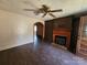 Inviting living room features decorative fireplace, archway, and wood-look flooring at 1222 Sparrow Springs Rd, Kings Mountain, NC 28086